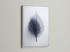 Leaf art is displayed in a white frame. The white frame creates a clean modern look. This frame highlights the intricate details of the artwork. A versatile choice for any room. Enhance your artwork with a white frame.