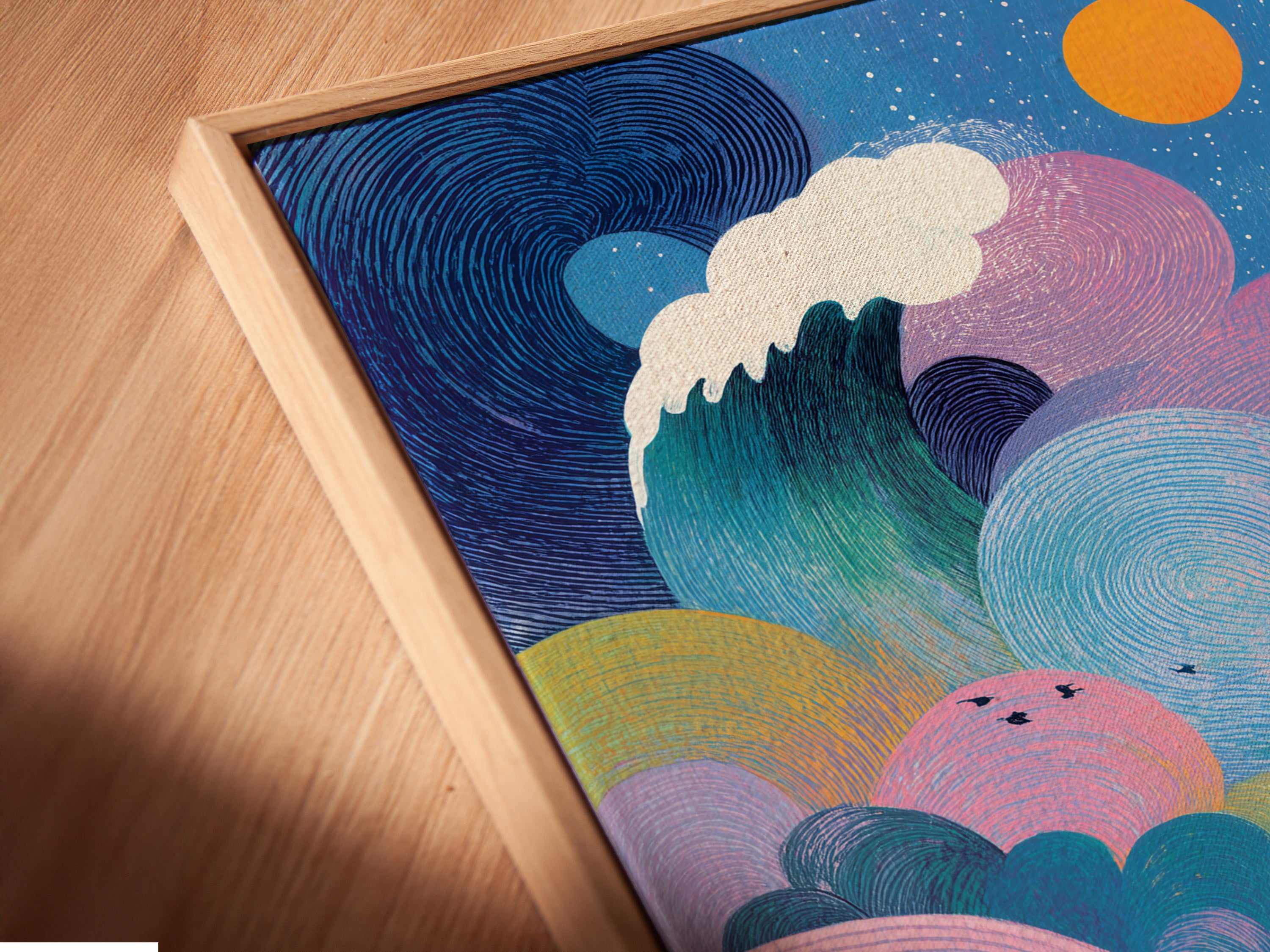 Close-up angled shot of a canvas print in a floating frame. The floating frame gives the illusion of the art hovering. The artwork is a vibrant ocean scene. This modern framing style enhances any artwork.