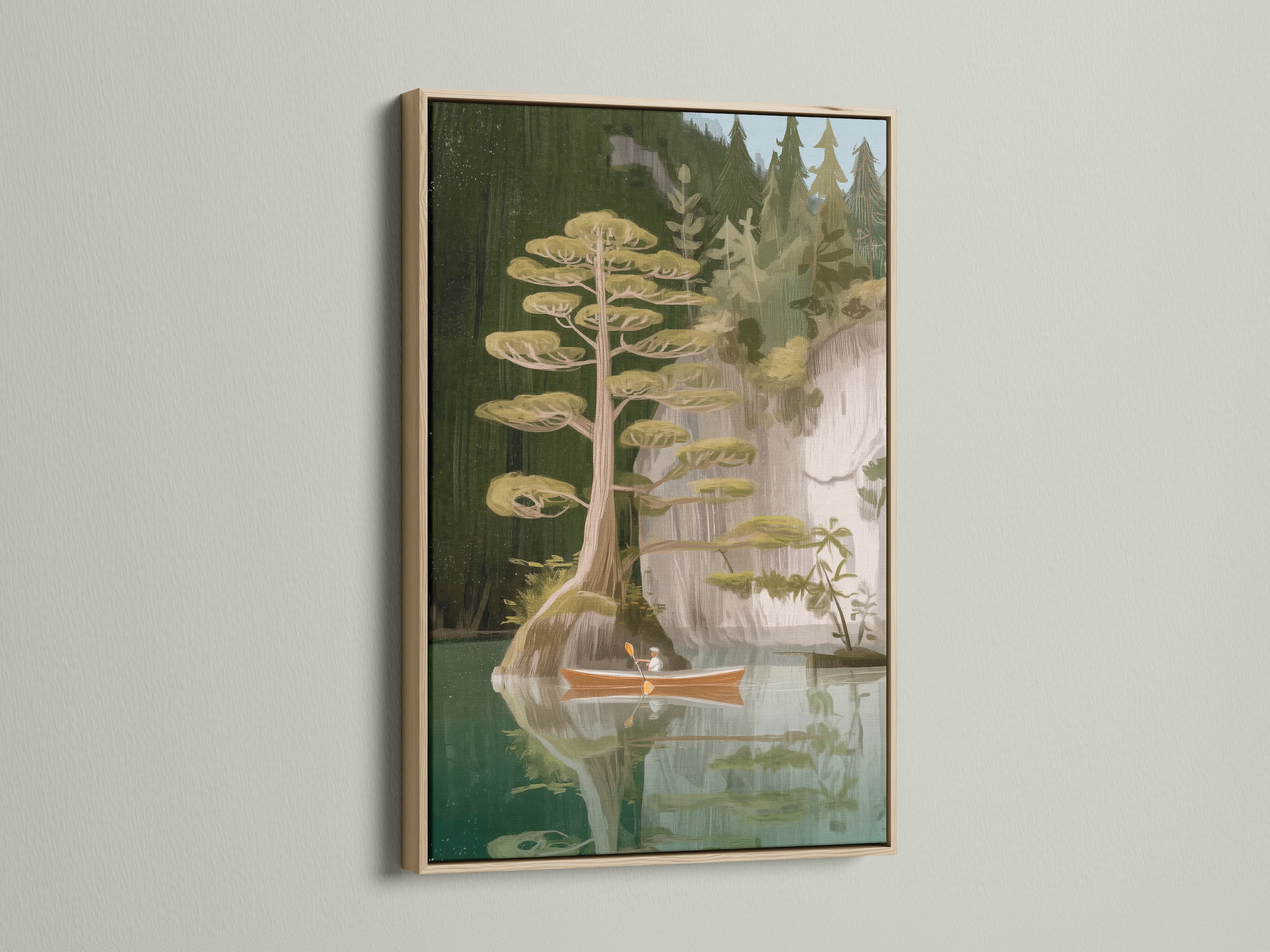 Lake and Canoe artwork with an oak frame. This frame enhances the natural beauty of the scene. The oak frame provides a warm rustic touch. Perfect for cabin decor or any space seeking a woodland print. Discover the beauty of nature wall art.