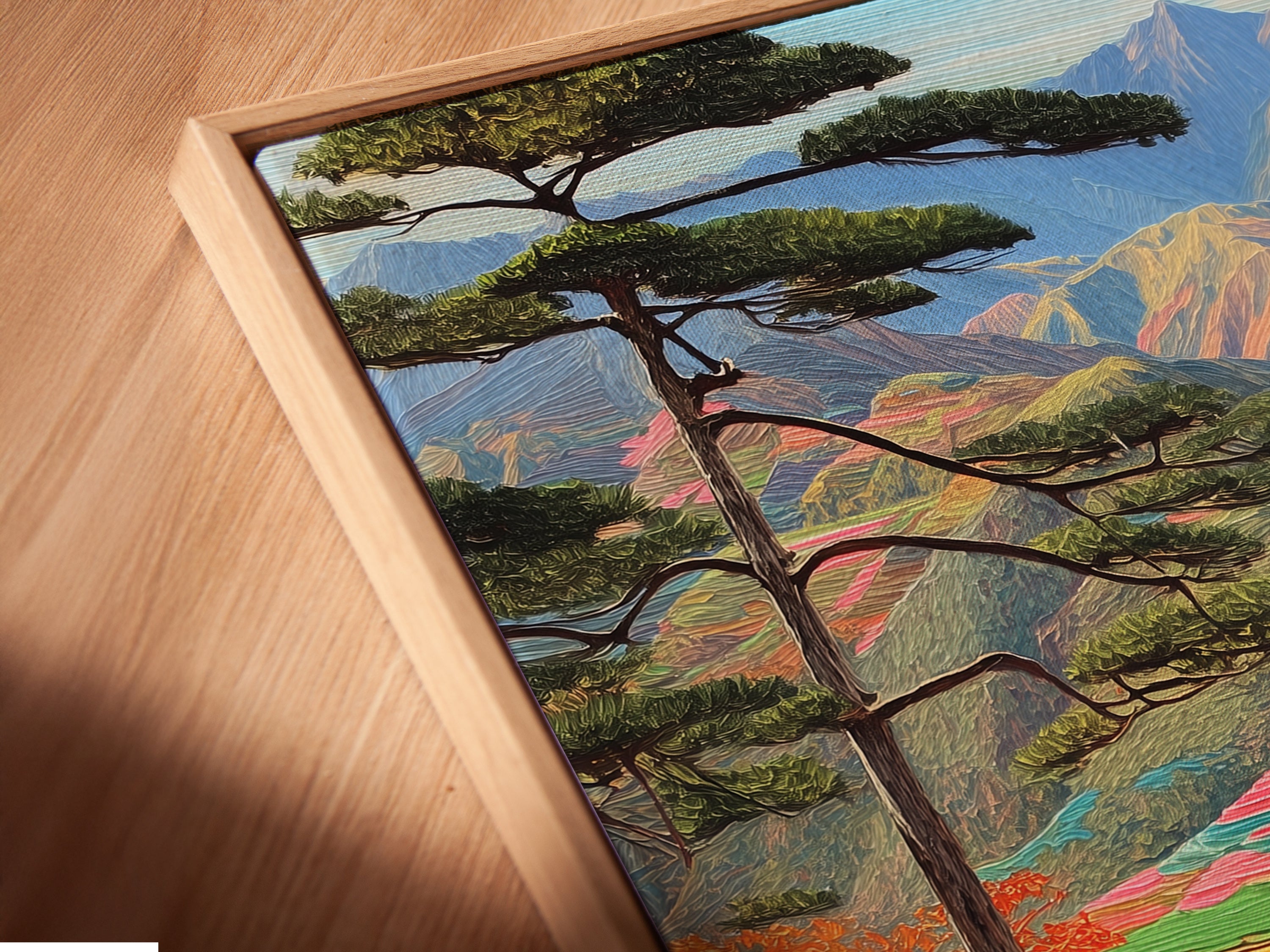 Close-up angled view of a canvas print in a floating frame. View the colorful mountain landscape. The terraced rice fields artwork enhances the texture. Perfect for a modern minimalist space.