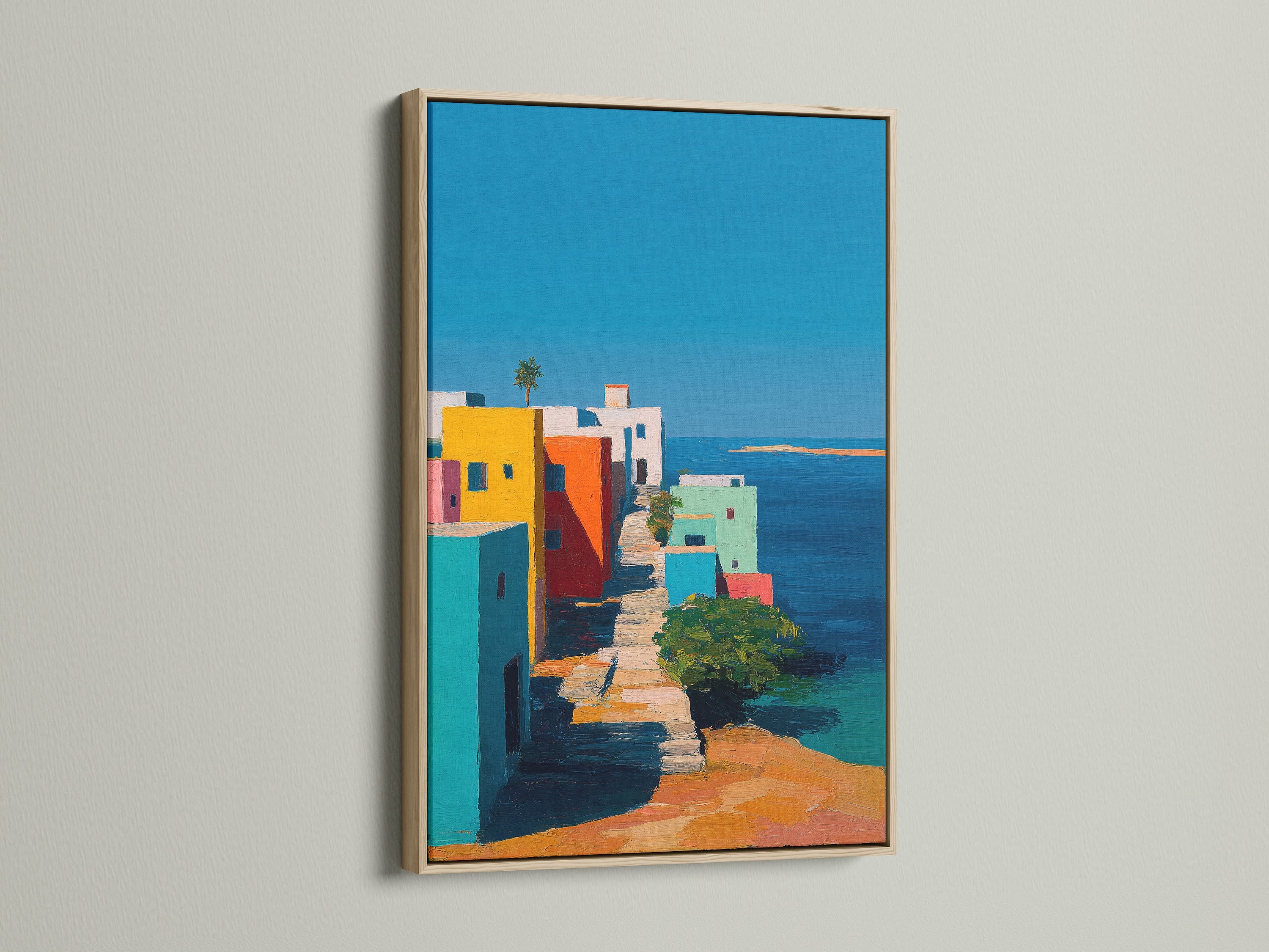 This showcases an oak frame around a beautiful art print. The frame enhances the artwork's visual appeal. The print features colorful buildings by the sea. It creates a focal point in any room. The oak frame adds a touch of warmth.
