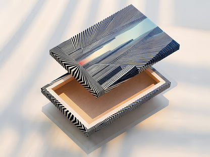 This is a stretched canvas print of the Cityscape Optical Illusion artwork. The modern black and white art is ready to hang. Transform your space with this urban wall decor. This geometric canvas adds a contemporary touch to any office or living room.