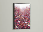 A striking black frame surrounds this floral meadow canvas artwork. The artwork is filled with red and white wildflowers. It offers a bold contrast and modern look. This botanical wall art is ideal for offices. Transform your space with this contemporary print.