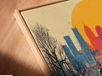 Angled close up of a canvas print in a floating frame. The City Skyline artwork shows a colorful sunset over an urban landscape. The floating frame adds a modern touch to this contemporary art piece. It's perfect for any space.