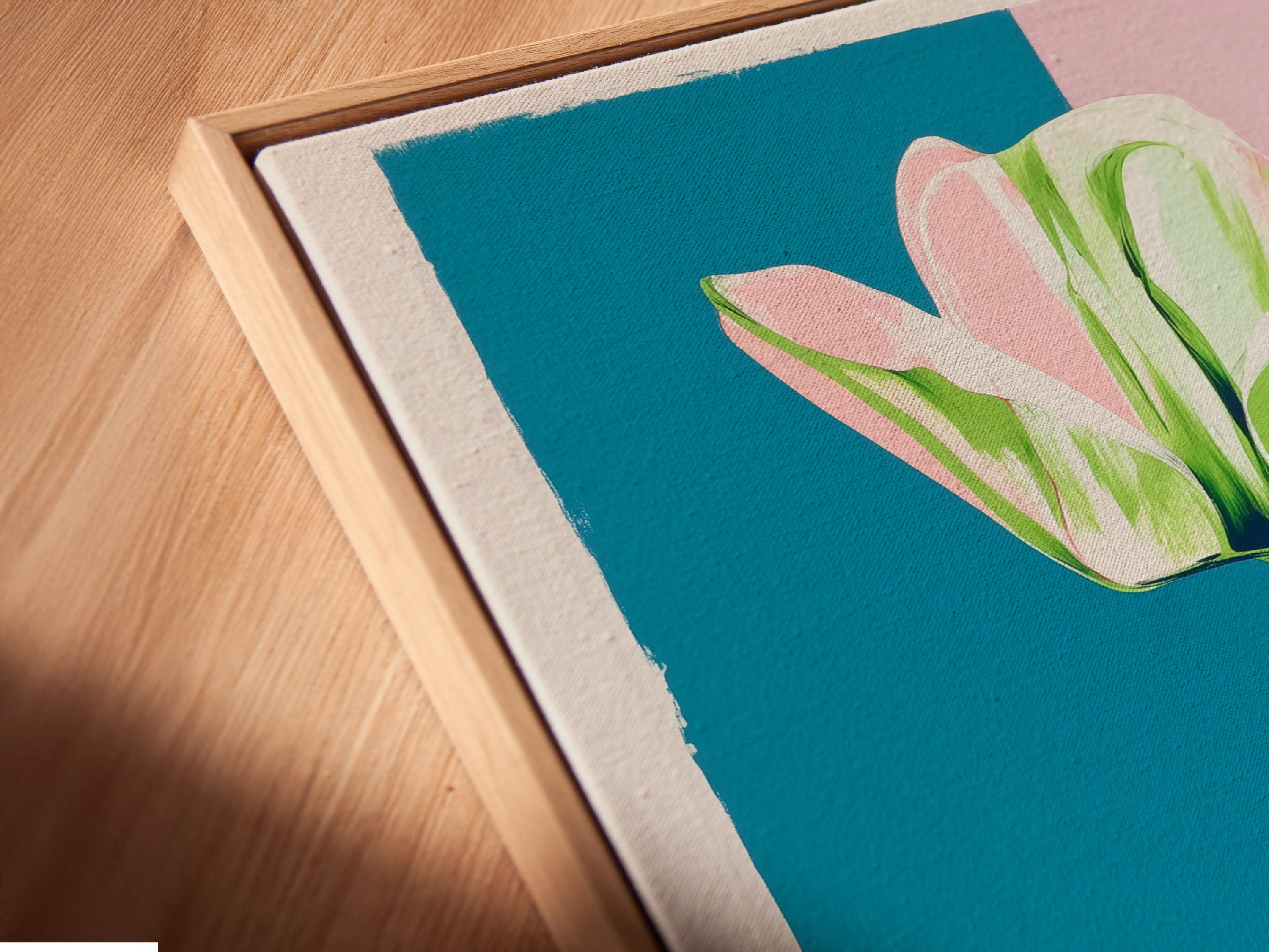 Close-up of a canvas print in a floating frame. The abstract tulip flower artwork is beautifully displayed. The floating frame adds depth and dimension. This modern art print is ready to hang and enjoy.