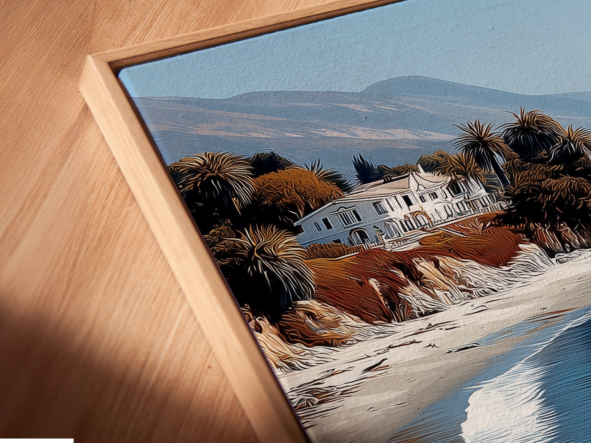 This is a close-up of a canvas print in a floating frame. The artwork shows a California coastal beach scene. The floating frame enhances the artwork's modern appeal. The serene seascape brings calming vibes to any room or office space.