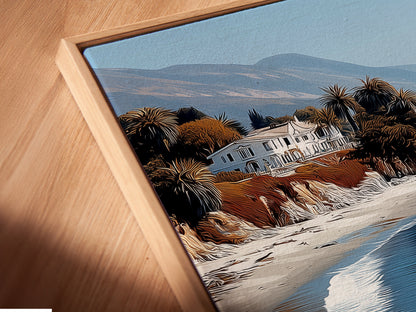 This is a close-up of a canvas print in a floating frame. The artwork shows a California coastal beach scene. The floating frame enhances the artwork's modern appeal. The serene seascape brings calming vibes to any room or office space.