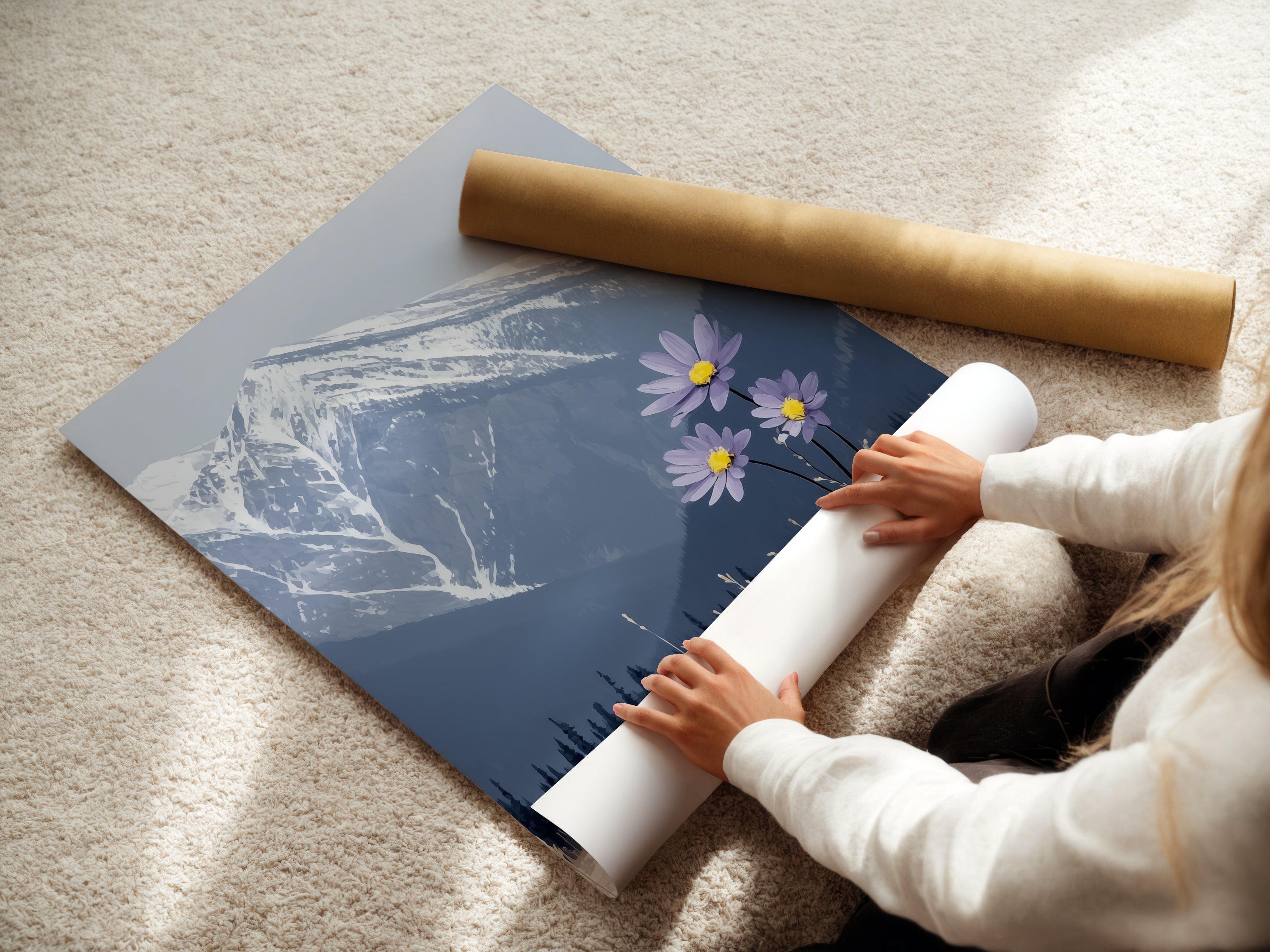 A woman carefully rolls a fine art poster paper. Preparing a mountain flower print. This winter landscape poster is ready for framing. Bring snowy mountain beauty and modern style into your home with this unique artwork.