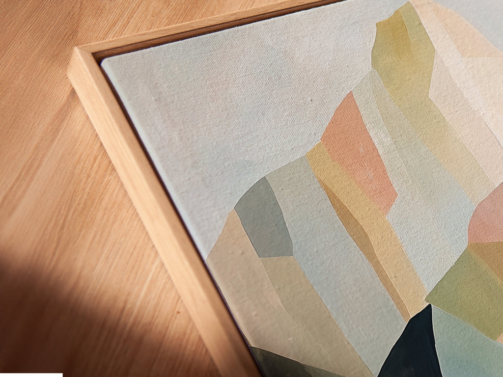 Angled close up of a canvas print featuring abstract mountain artwork in a floating frame. The contemporary wall art complements minimalist and modern aesthetics. Elevate your space today.