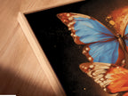 An angled close-up highlights a canvas print in a floating frame. The butterfly artwork appears to hover adding depth. The blue and orange insect print enhances minimalist aesthetics. Perfect for renters seeking elevated wall art.