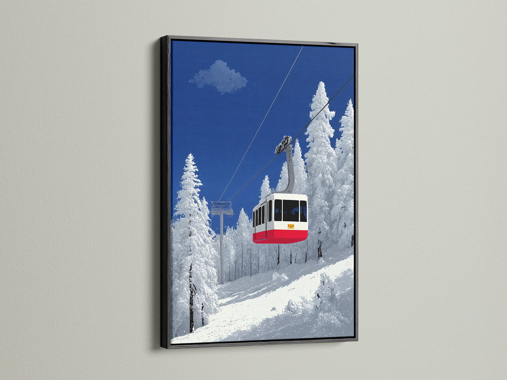 A black frame highlights this ski lift artwork. It features a winter mountain landscape. An alpine cable car is central to the piece. Ideal for cabin decor the snowy scene adds a touch of winter. The black frame provides a bold contrast. It makes the blue and white colors pop in any room.