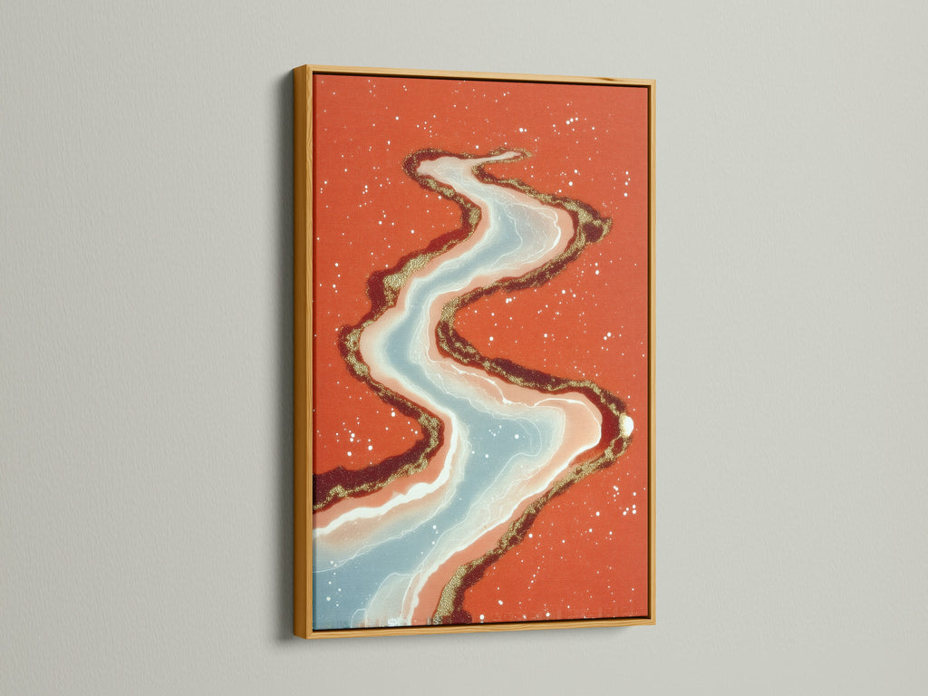 This abstract river art print is displayed in a gold frame. The flowing water artwork will add a touch of luxury to your space. Coral orange and teal blend beautifully. This modern canvas art is perfect for a sophisticated bedroom or living room. Explore this stunning piece today.