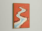 This abstract river art print is displayed in a gold frame. The flowing water artwork will add a touch of luxury to your space. Coral orange and teal blend beautifully. This modern canvas art is perfect for a sophisticated bedroom or living room. Explore this stunning piece today.