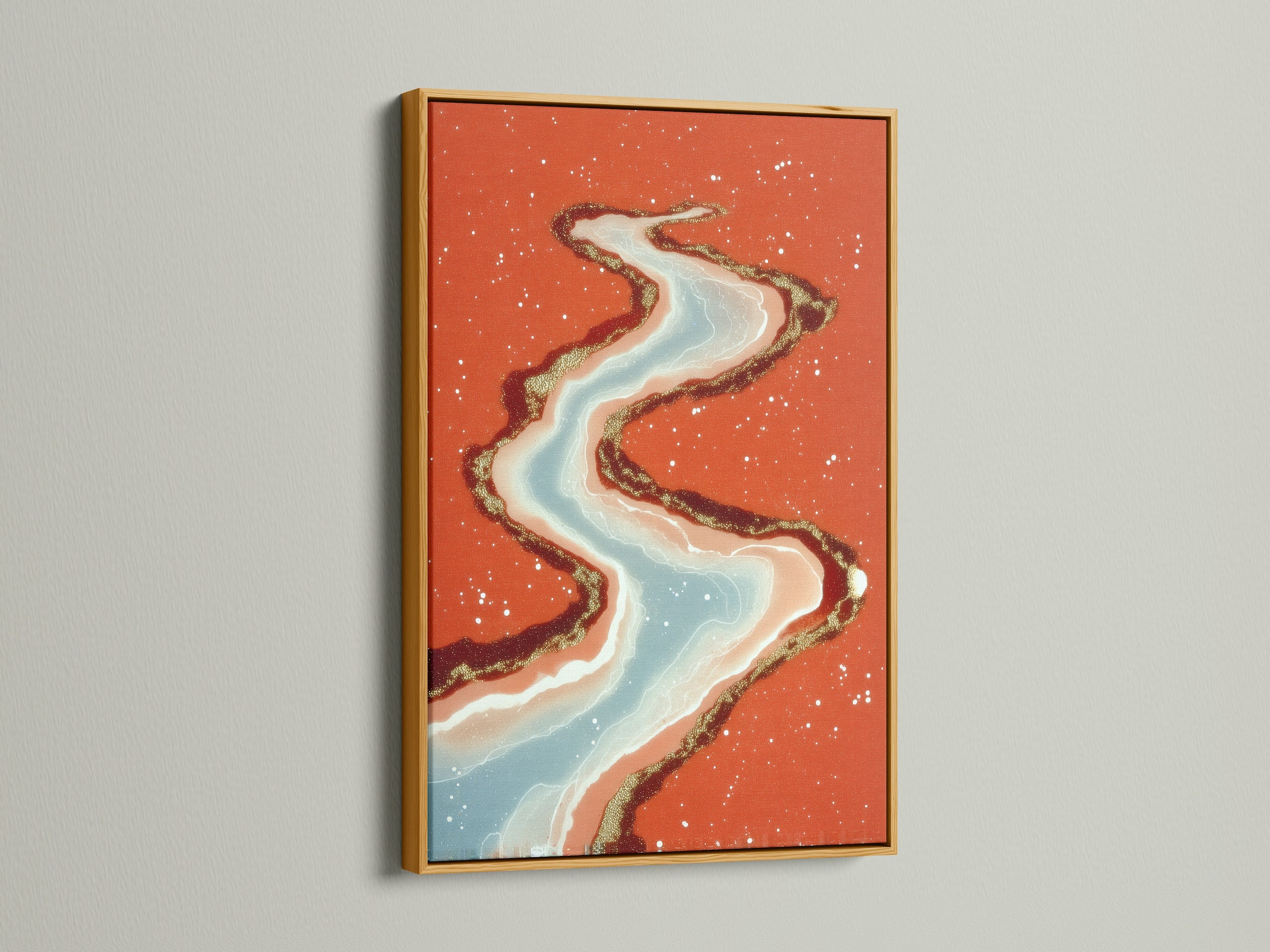 This abstract river art print is displayed in a gold frame. The flowing water artwork will add a touch of luxury to your space. Coral orange and teal blend beautifully. This modern canvas art is perfect for a sophisticated bedroom or living room. Explore this stunning piece today.