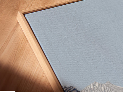 A close-up angled view of a canvas print in a floating frame. The floating frame gives the artwork a contemporary look. The canvas print showcases intricate details. The artwork appears to float within the frame. This art enhances the viewing experience.