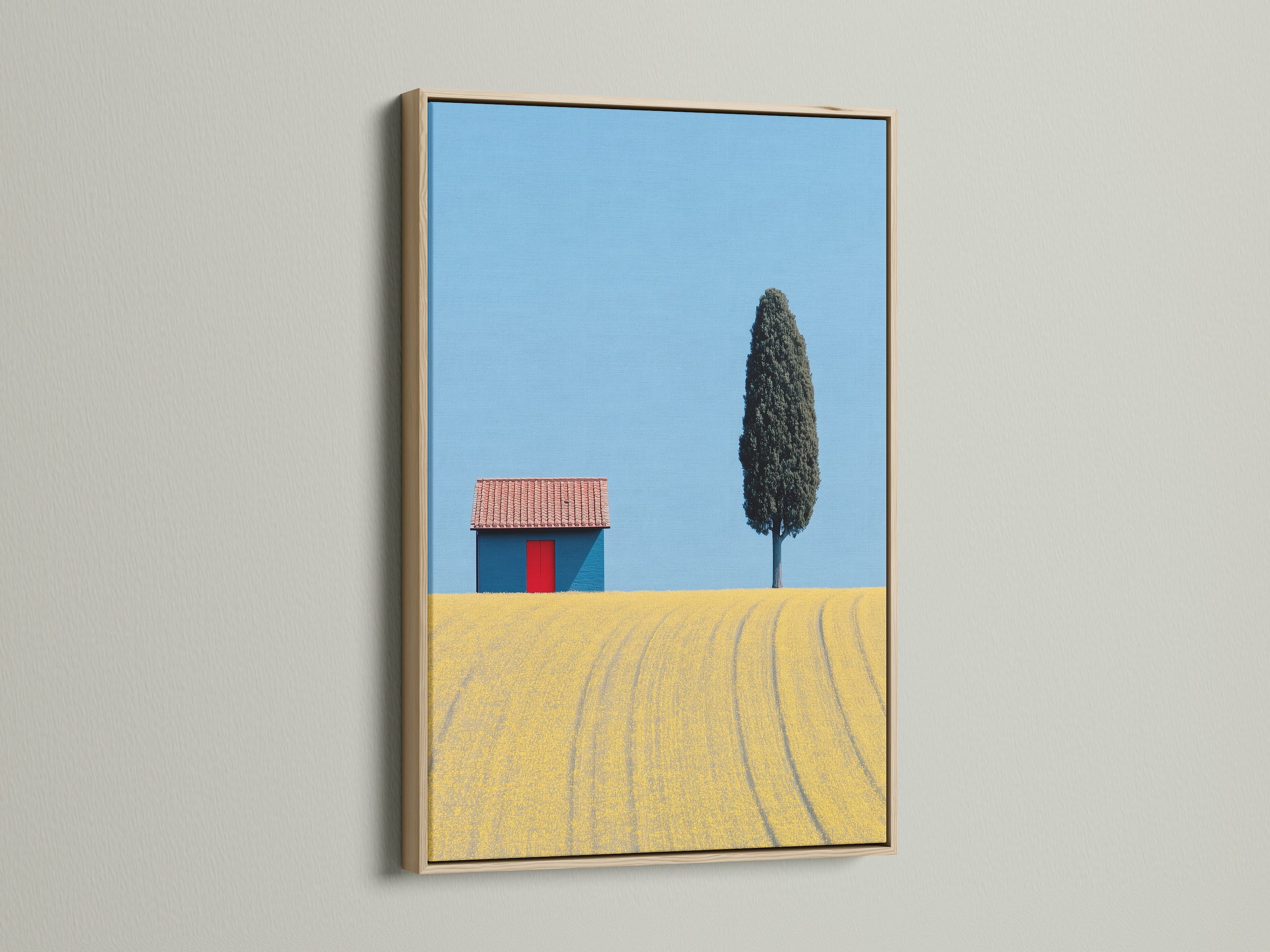 Tuscany Landscape artwork with an oak frame. This Italian art piece captures the beauty of the countryside. A blue sky and yellow field create a serene scene. Ideal farmhouse wall art.