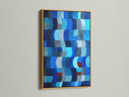 This image presents an abstract blue artwork with a gold frame. The gold frame adds a touch of elegance to the modern piece. Gold is ideal for navy blue decor. This artwork will enhance your coastal home decor. Discover geometric prints for your home.