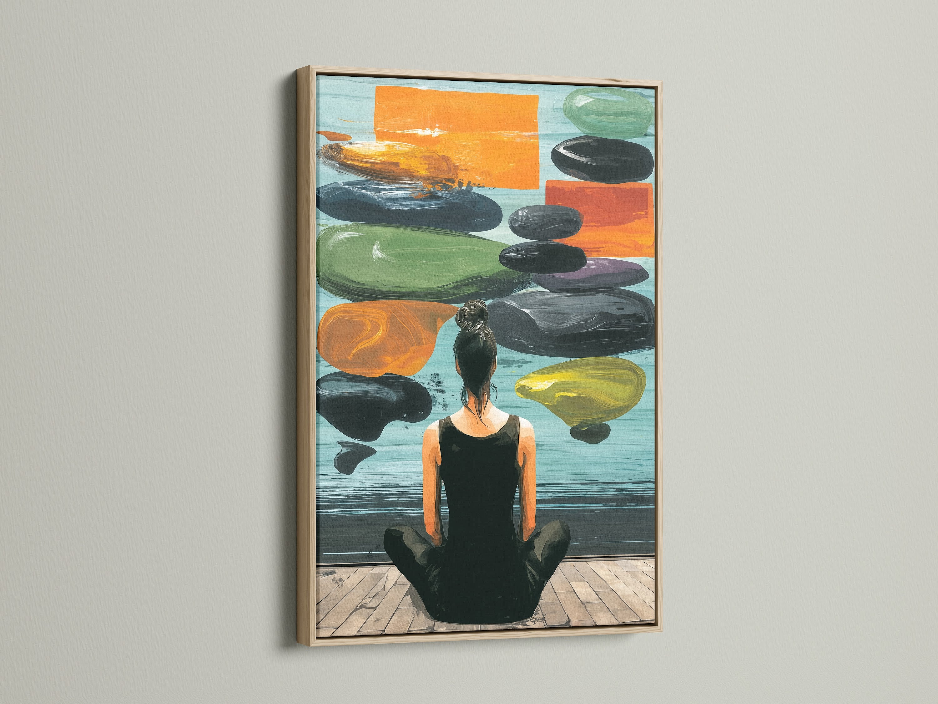 Zen Wall Art in an oak frame is displayed on a white wall. This artwork features a woman meditating. The artwork creates a peaceful atmosphere. It's a great addition to living rooms bedrooms or yoga studios.