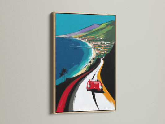 Coastal Road Trip art print in an oak frame. The artwork features a vintage car on a scenic highway. This retro travel art enhances office wall decor. Ideal for garage art man cave decor and showrooms.