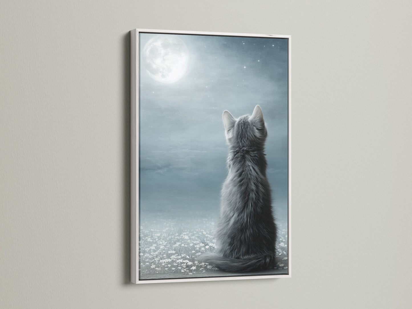 The Cat Moon Canvas Print is displayed in a white frame. The clean white frame enhances the whimsical art. This kitten canvas adds a touch of serene beauty to your walls. Perfect for creating a peaceful ambiance in any room. A beautiful piece for nursery decor.