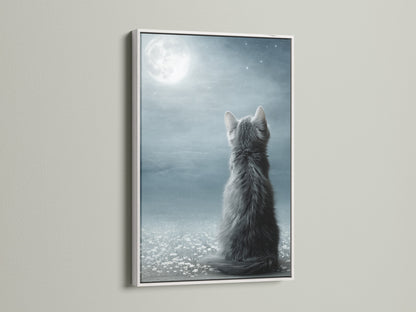 The Cat Moon Canvas Print is displayed in a white frame. The clean white frame enhances the whimsical art. This kitten canvas adds a touch of serene beauty to your walls. Perfect for creating a peaceful ambiance in any room. A beautiful piece for nursery decor.
