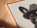 A close up angled view shows a canvas print in a floating frame. The French Bulldog artwork looks stunning. This enhances the quirky animal wall art. The floating frame adds a modern touch. Perfect for showcasing your vintage dog poster.