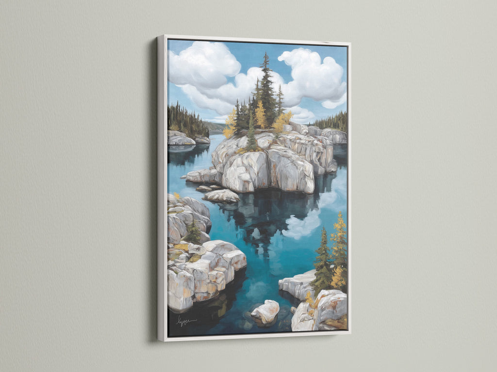 Enhance your living room with this captivating lake landscape canvas print. The nature painting is set in a white frame. The artwork's serene island artwork and teal blue decor create a calming atmosphere. This is great for minimalist and rustic styles.