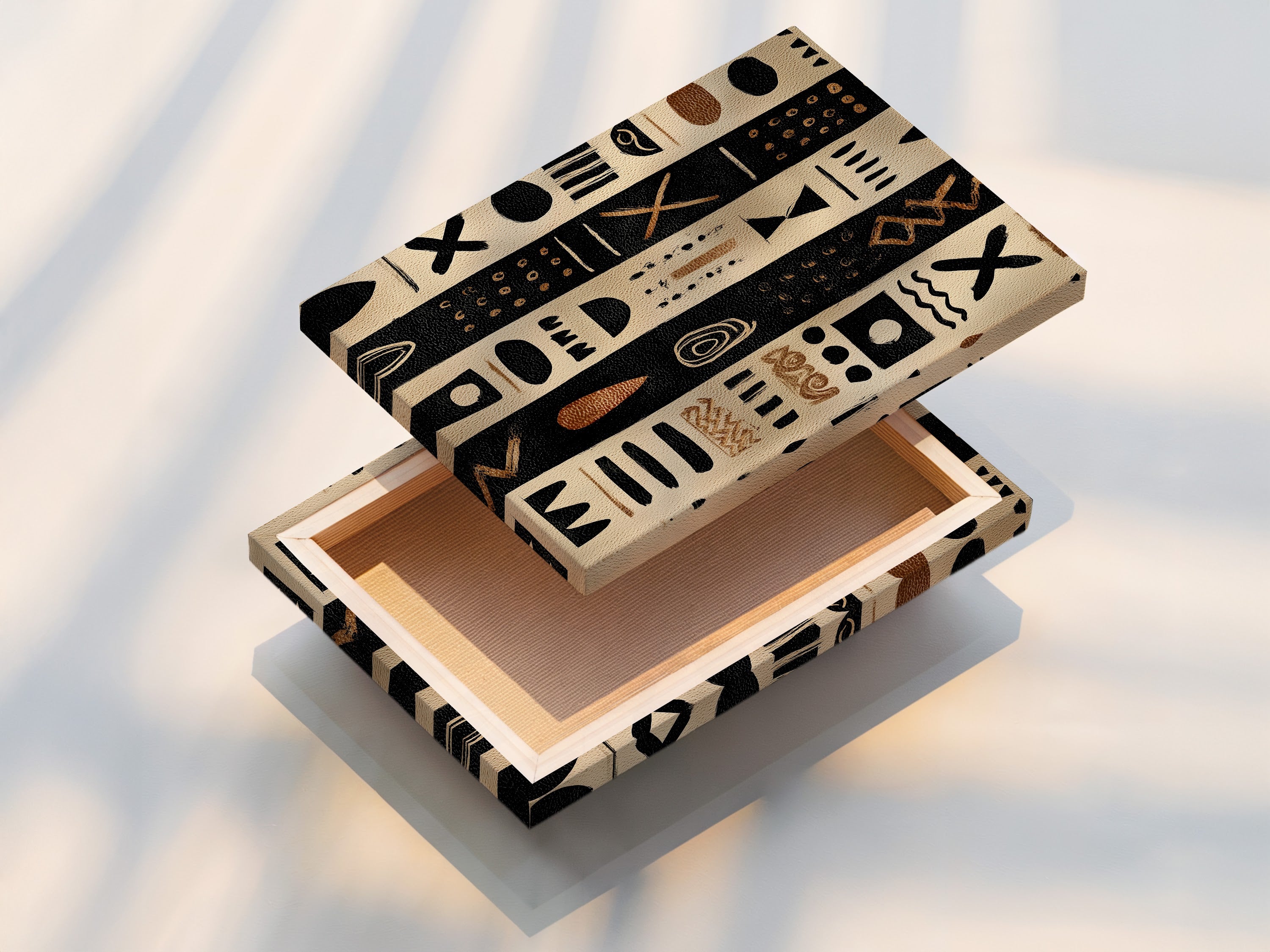 A stretched canvas print. The artwork has black and tan stripes with tribal inspired shapes. The canvas is stretched tightly over a wooden frame. The canvas print is ready to hang. This format enhances the texture of the artwork.