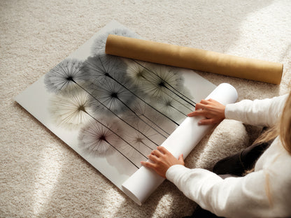 A woman is carefully rolling a fine art poster paper. This ensures your dandelion art arrives in perfect condition. High-quality botanical prints for your home. Perfect for creating modern floral decor. Get your neutral wall art delivered safely.