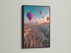 The black frame contrasts beautifully with the hot air balloon artwork. This landscape canvas adds a sophisticated touch to any space. Ideal as travel wall art. It is perfect for modern interiors and eclectic styles.