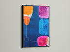 Colorful Abstract Artwork in a Black Frame. This striking geometric canvas art features a navy blue backdrop with vibrant pink orange and blue elements. Ideal for adding a touch of modern style to your living room or office. A perfect choice for contemporary art lovers