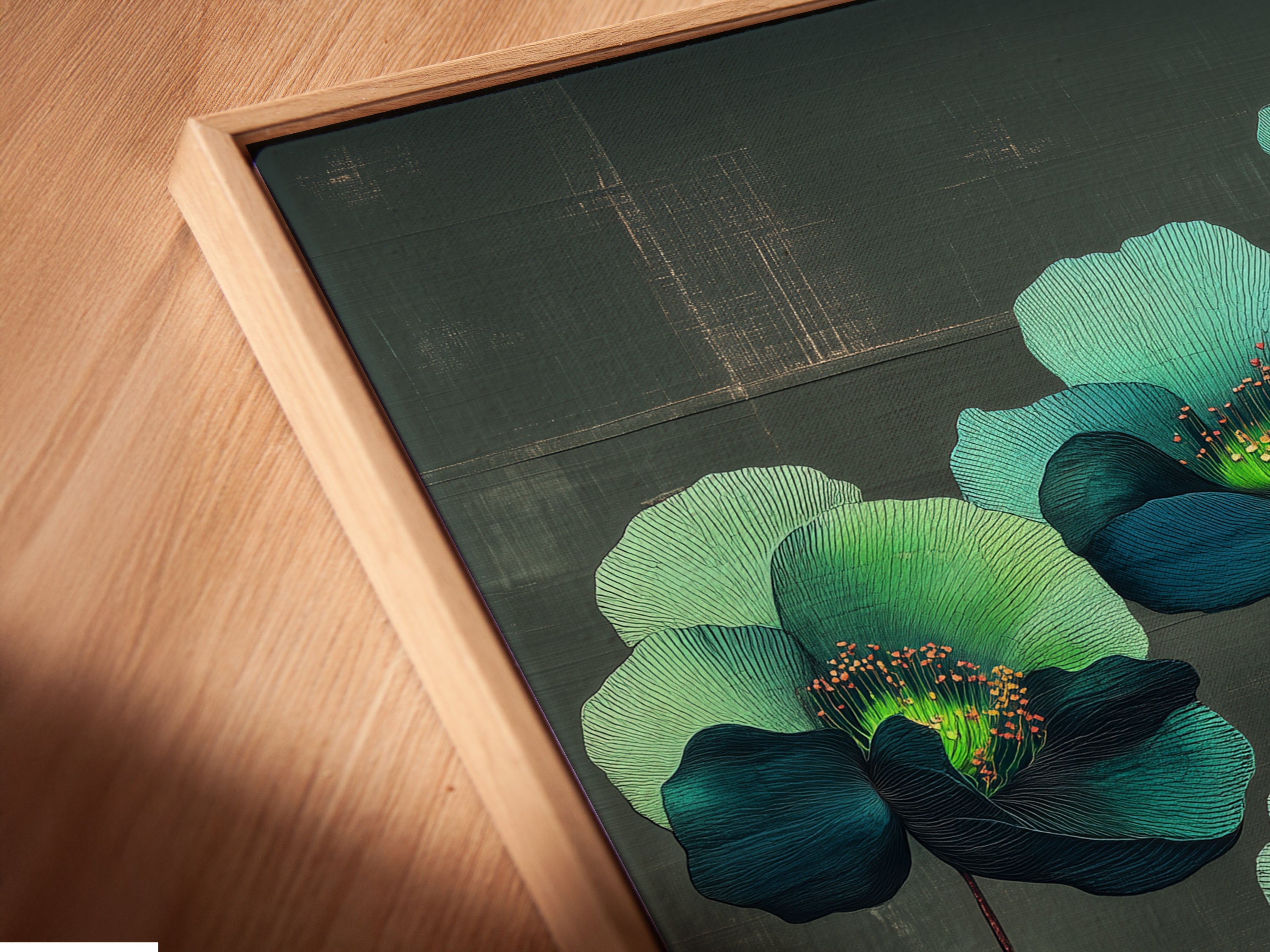 Angled close-up view of a canvas print featuring teal and green floral botanical artwork in a floating frame. The floating frame enhances the art piece. It gives the illusion that it is suspended creating a focal point.