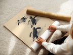 A woman is carefully rolling a fine art poster paper. The high-quality paper ensures a beautiful print. Perfect for creating stunning coastal wall art. Ideal for nurseries and beach houses.