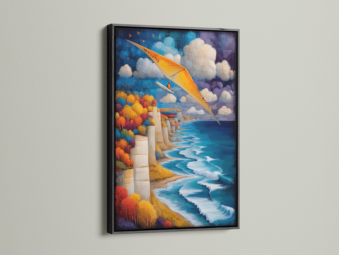 Hang gliding artwork in a black frame. Aviation wall art ideal for bedrooms. The art shows a beautiful blue ocean and sky. Add a touch of adventure with this seascape artwork. It is great for travel themed spaces. Perfect for business owners looking for wall decor.