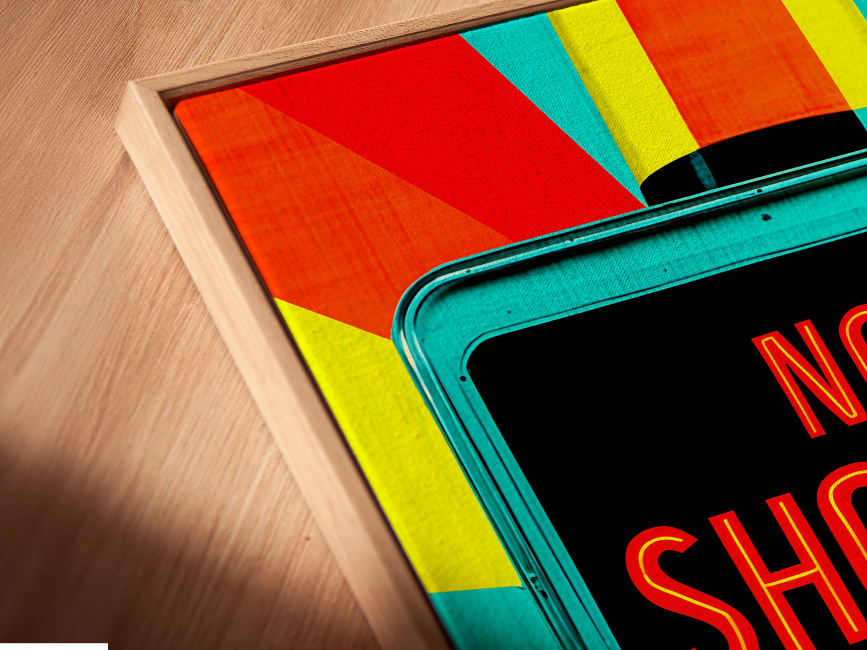 A close-up angled shot of a canvas print in a floating frame. The floating frame gives the artwork a modern sophisticated look. Perfect for showcasing your favorite retro movie theater art.