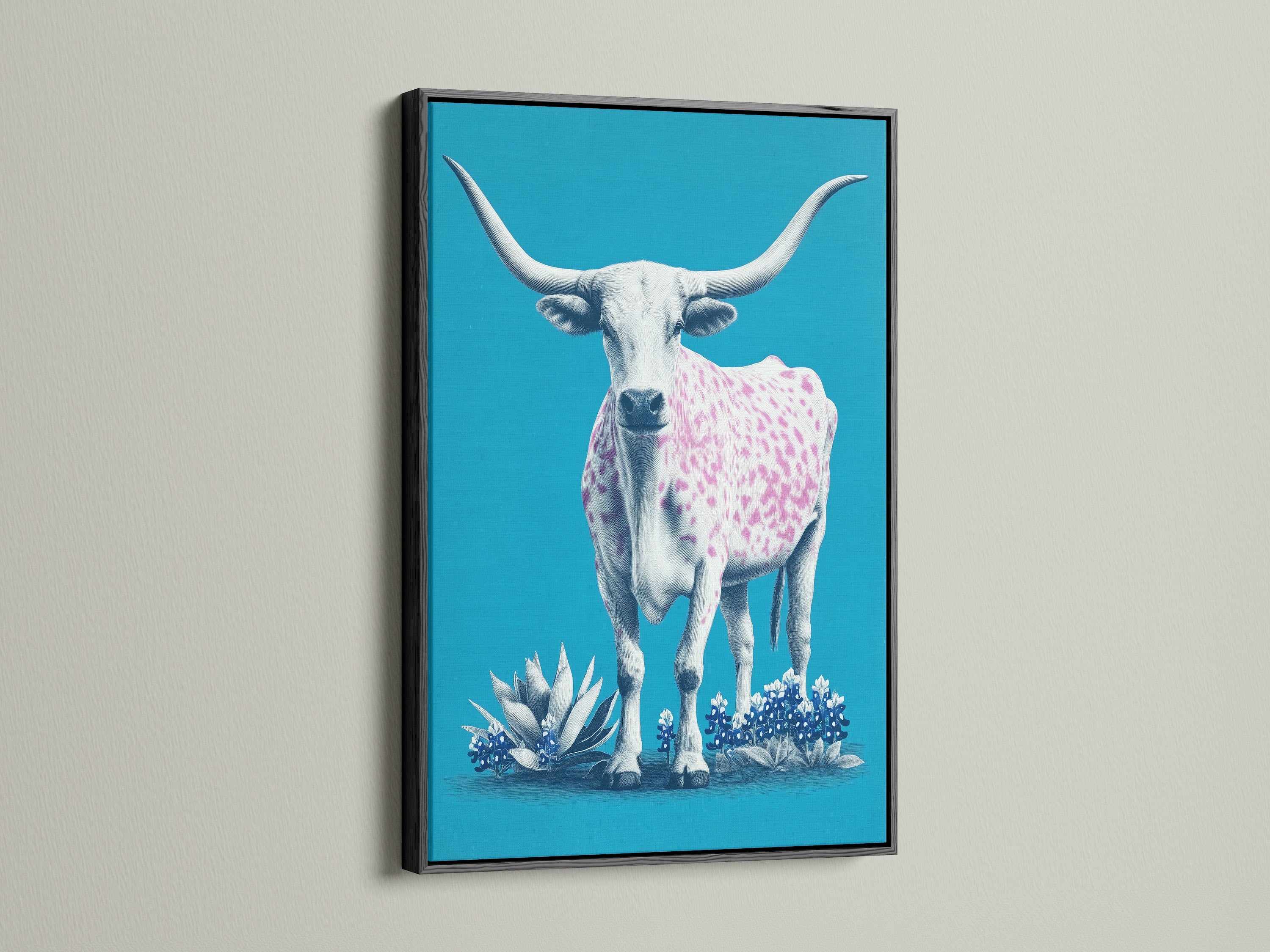 A longhorn cow artwork showcased in a black frame. The artwork features a turquoise background. A cow with pink spots stands out. The black frame adds a bold contrast. This piece is perfect for a sophisticated western theme.