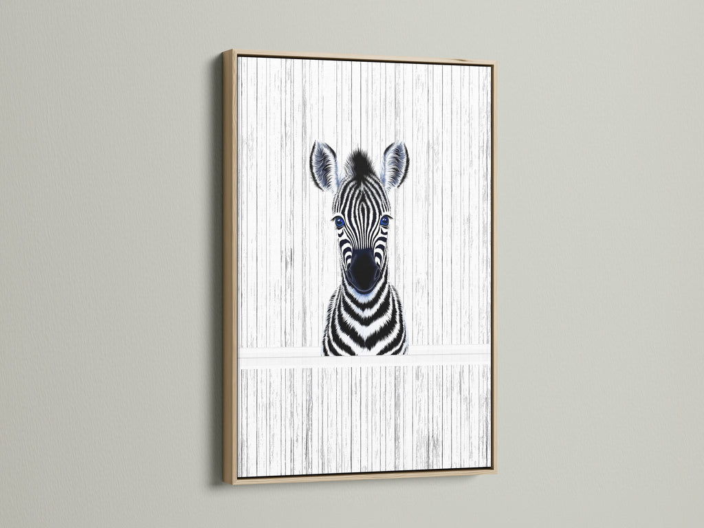 A charming Baby Zebra artwork framed in oak. This minimalist zebra wall art adds a touch of safari to any nursery or kids room. The oak frame enhances the black and white animal poster. A perfect piece of monochrome art.
