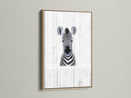 A charming Baby Zebra artwork framed in oak. This minimalist zebra wall art adds a touch of safari to any nursery or kids room. The oak frame enhances the black and white animal poster. A perfect piece of monochrome art.