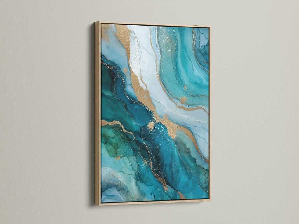 The abstract ocean artwork features flowing teal and gold. It is showcased in an oak frame. This modern fluid art print brings a touch of luxury to any room. Ideal for homeowners looking for elegant contemporary wall decor.