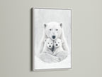 A white frame complements this polar bear artwork. The monochrome animal canvas creates a clean contemporary look. This wildlife wall art is a great addition to baby room decor and nature wall art.
