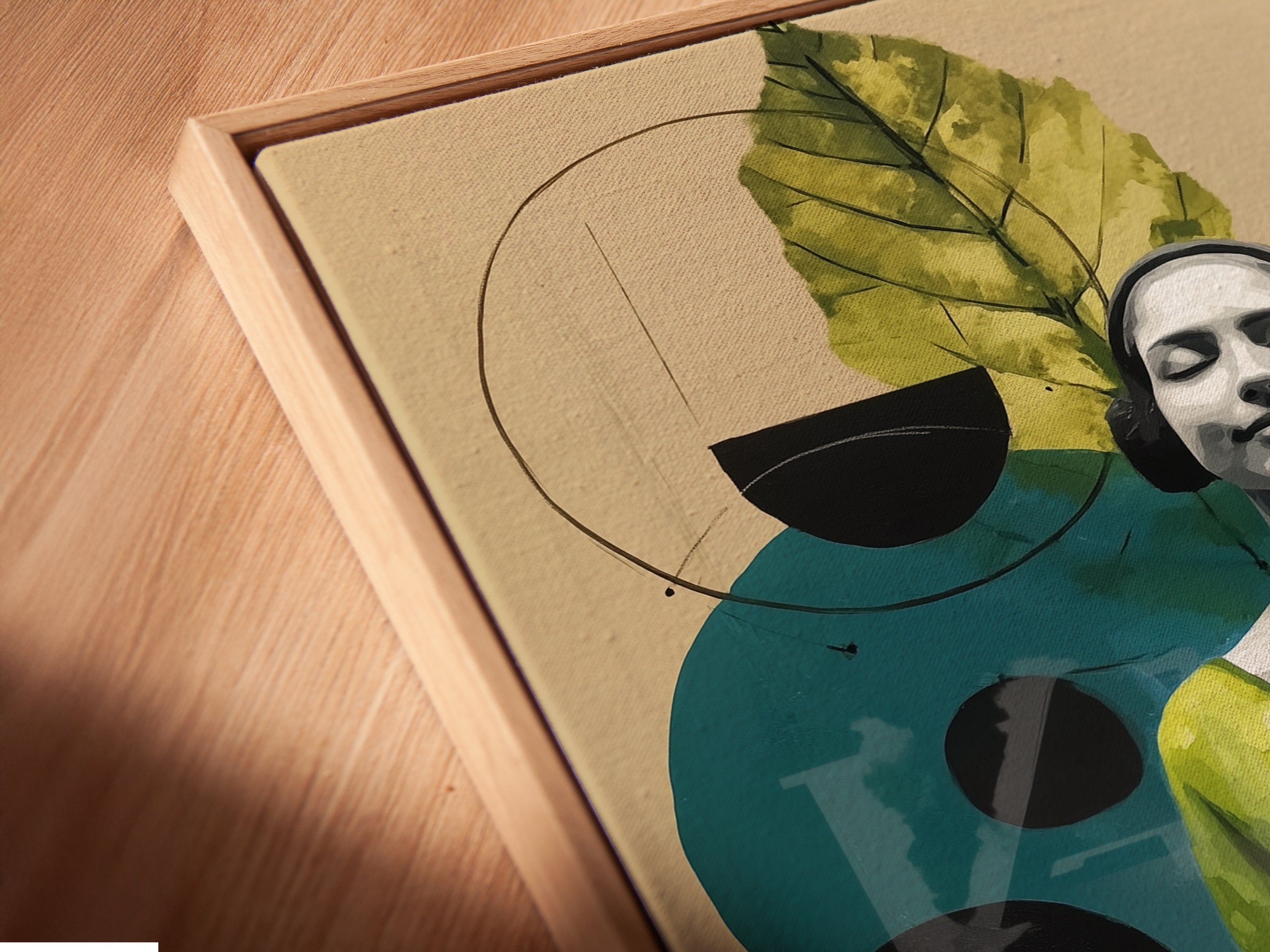 A close-up angled view reveals a canvas print in a floating frame. The artwork seems to hover. This abstract woman botanical piece is truly captivating. Perfect for minimalist or bohemian spaces. The floating frame enhances its beauty.