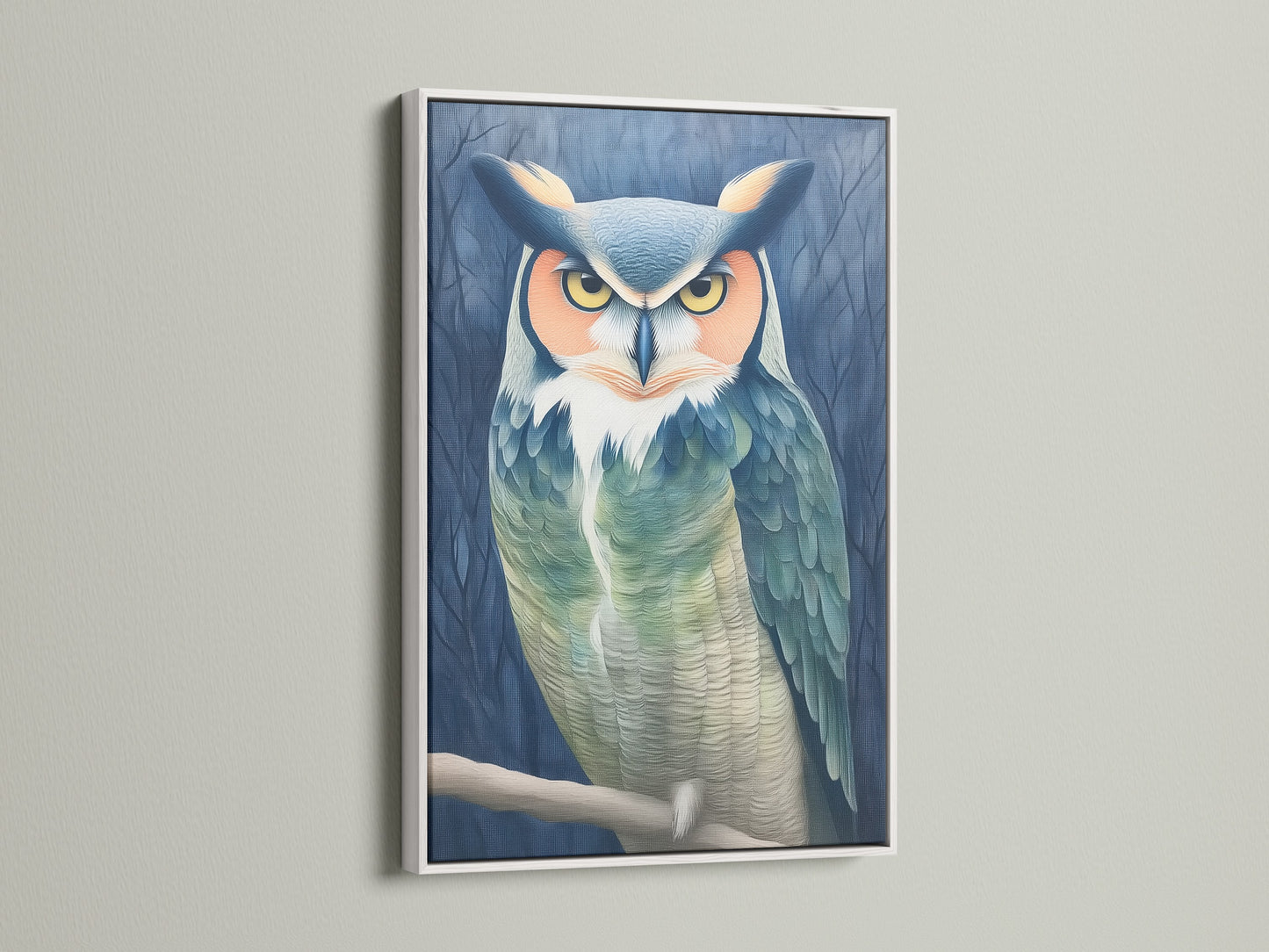 The owl portrait canvas print is elegantly framed in white. This animal print brings a touch of nature to your walls. The teal and beige artwork adds a moody yet calming vibe. This bird canvas enhances any study room or living space.
