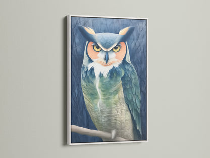 The owl portrait canvas print is elegantly framed in white. This animal print brings a touch of nature to your walls. The teal and beige artwork adds a moody yet calming vibe. This bird canvas enhances any study room or living space.
