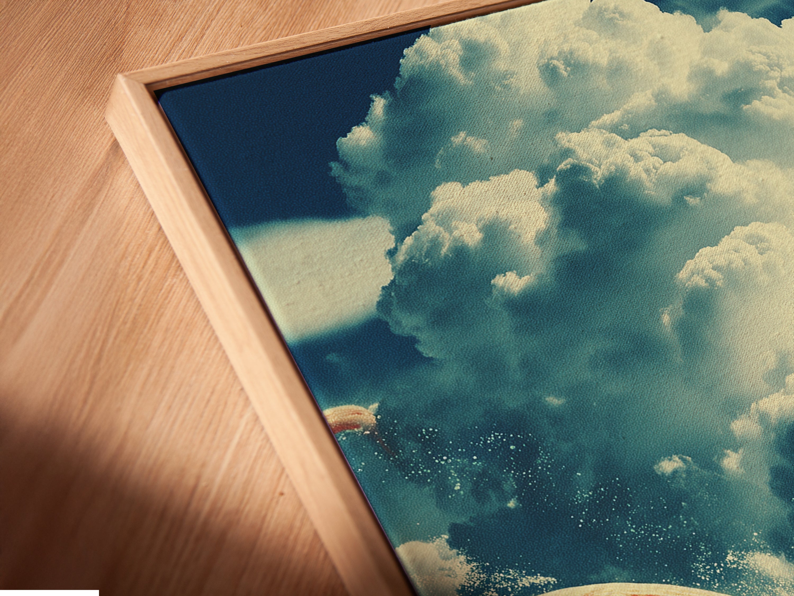 A close-up angled view shows a canvas print in a floating frame. This modern framing style gives the artwork a unique look. The floating frame enhances the depth and dimension of the piece. Perfect for highlighting the surreal artwork. It adds a contemporary touch to your wall.