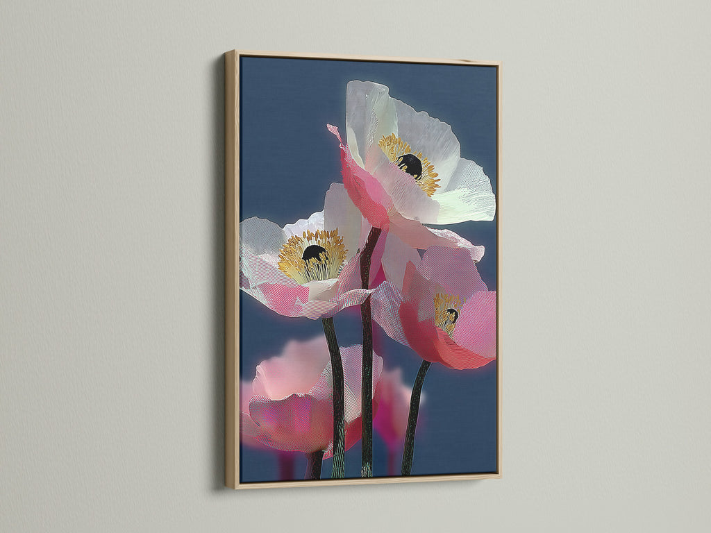 A framed floral canvas print with an oak frame hangs on a wall. The artwork is a modern botanical art piece. It features pink poppy art. The contemporary wall art is ideal for homeowners and renters. It enhances living rooms bedrooms and offices.
