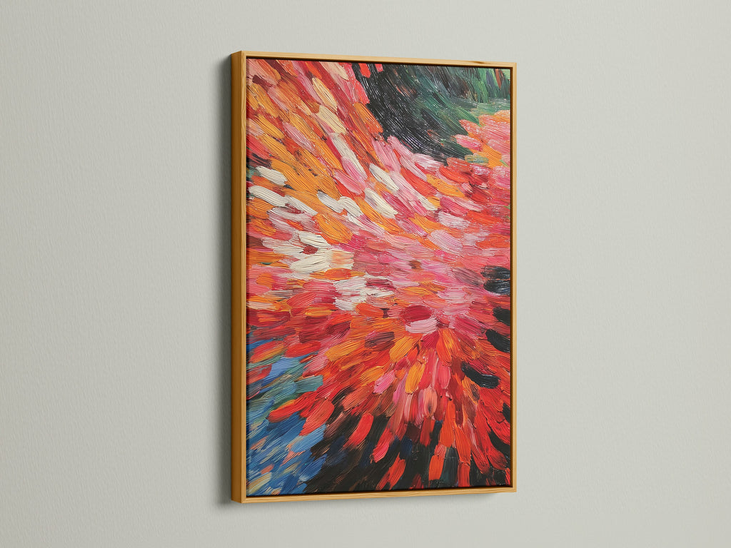 The abstract burst artwork is presented in a gold frame. The red and orange colors create a fiery effect. Dynamic brushstrokes add movement to this modern piece. It's perfect for elevating your living room bedroom or office space with colorful wall decor.