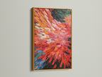 The abstract burst artwork is presented in a gold frame. The red and orange colors create a fiery effect. Dynamic brushstrokes add movement to this modern piece. It's perfect for elevating your living room bedroom or office space with colorful wall decor.