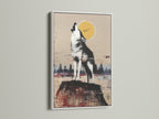 Rustic wildlife wall art featuring a howling wolf under the moon. The artwork is framed in a white frame. Bring nature indoors with this stunning animal canvas print. Perfect for cabin wall decor or living room wall art.