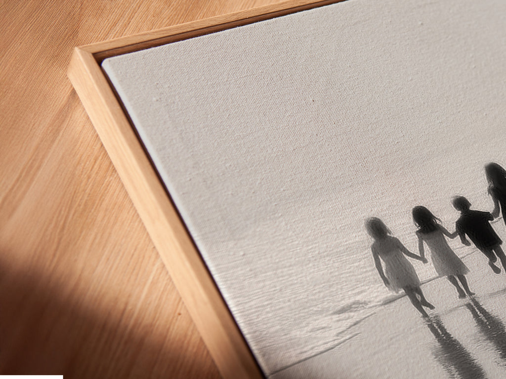 A close-up shows the Beach Walk canvas print in a floating frame. The black and white seascape photography highlights every detail. Perfect for nursery decor or kids room art. This minimalist art piece is a stunning family photo.