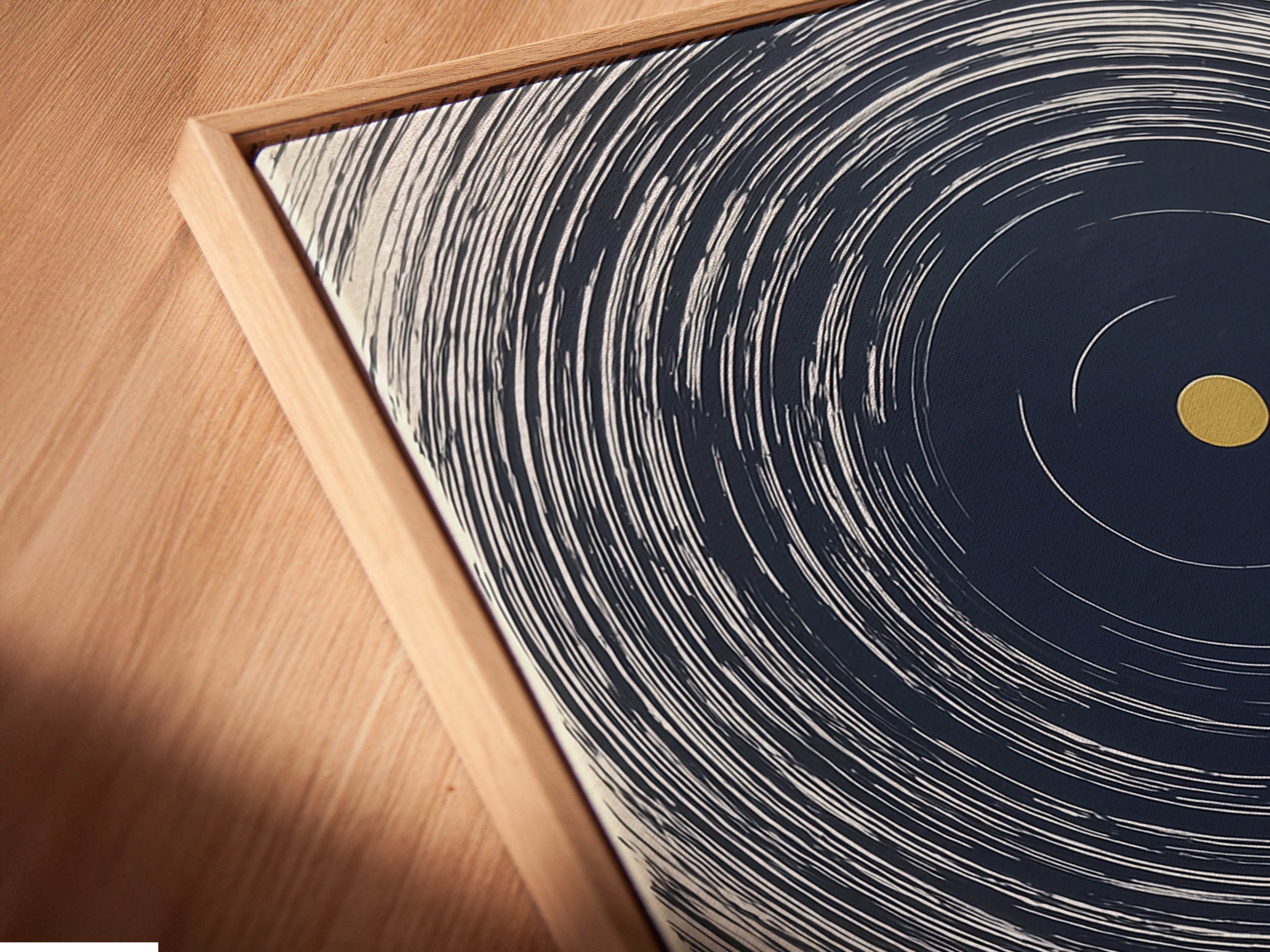 A close-up angled view reveals the exquisite detailing of a canvas print within a floating frame. This contemporary style adds depth and dimension to abstract artwork. It's perfect for modern home decor and contemporary spaces.